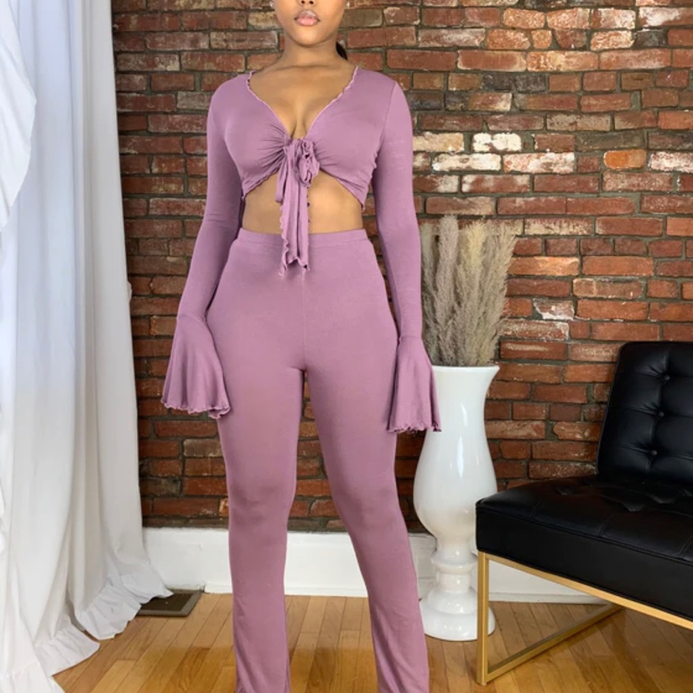 NWT 2 piece pants set. Beautiful material. Never worn.